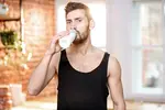 Sportsman drinking milk