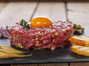 Steak tarare with dark egg yolk