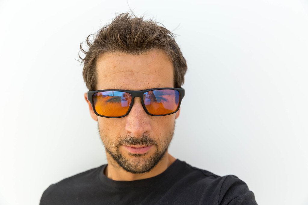 Man wearing blue blocking glasses.