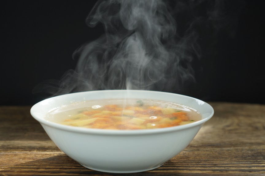 Bowl of steaming hot soup.