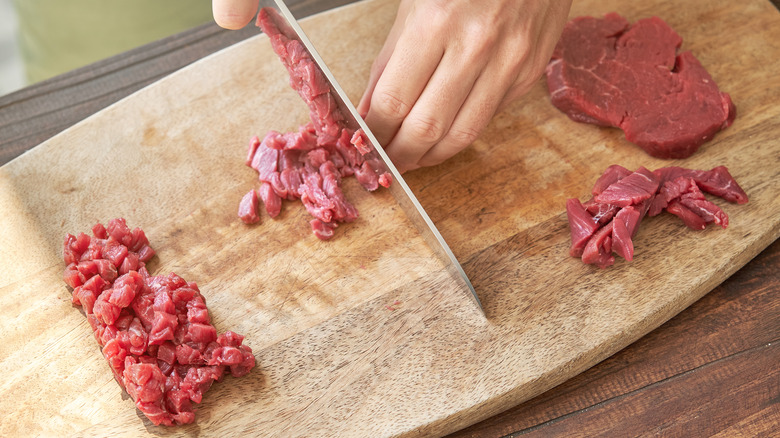 Cutting beef for steak tartare.
