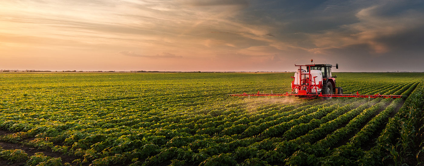 A farmer spraying his fields.