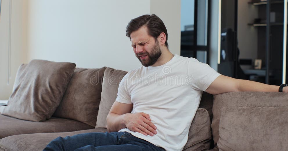Person experiencing indigestion which could be due to lack of enzymes.