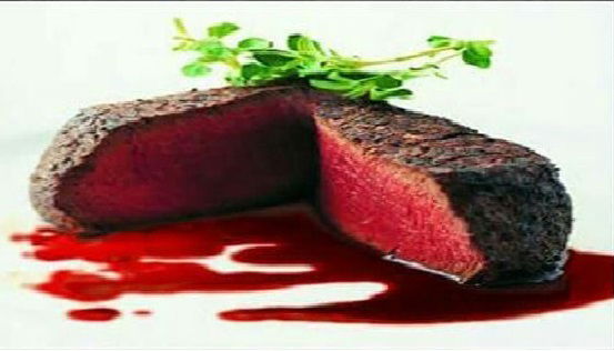 Rare steak with lost blood juices.