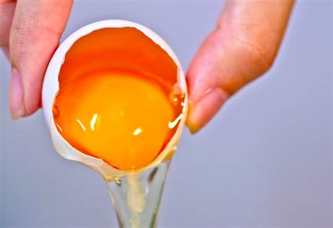 A cracked open raw egg.