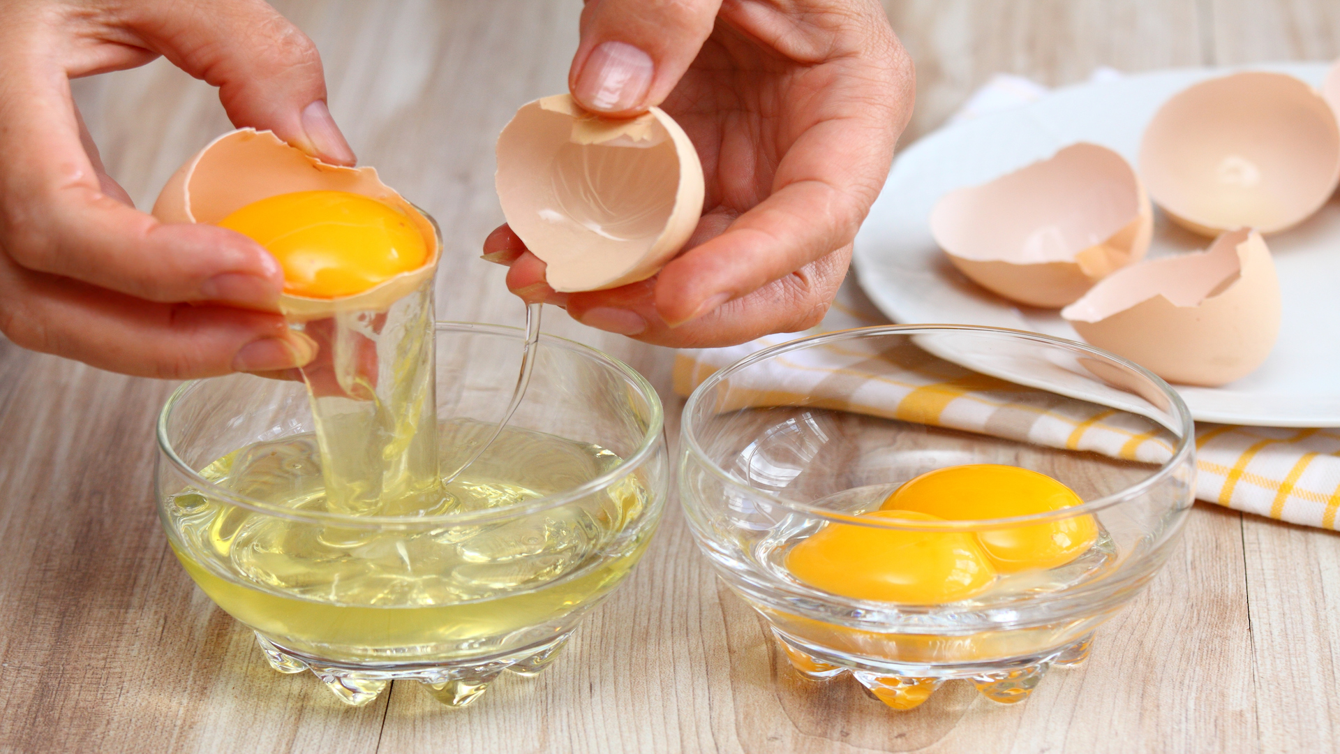Separating egg whites from yolks.