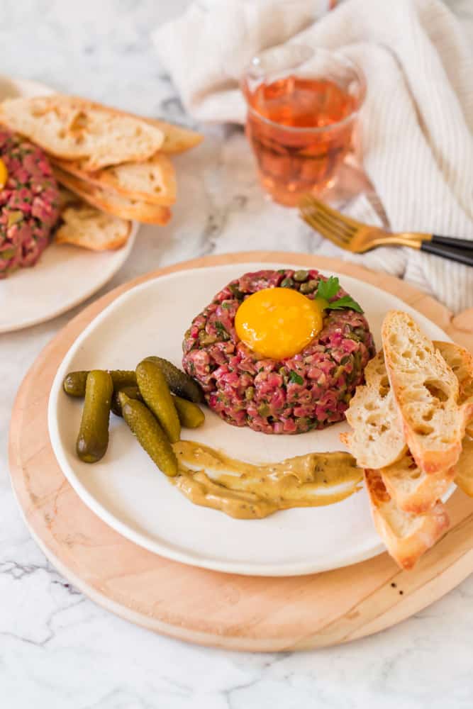 Steak tartare dinner with toasted bread.
