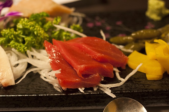 Eating raw foods like tuna sashimi.